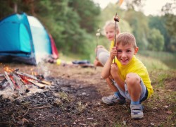 photo of happy children hiking in the forest