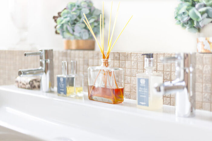 bathroom scents aromatherapy in the bathroom on the white sink with plants in the background