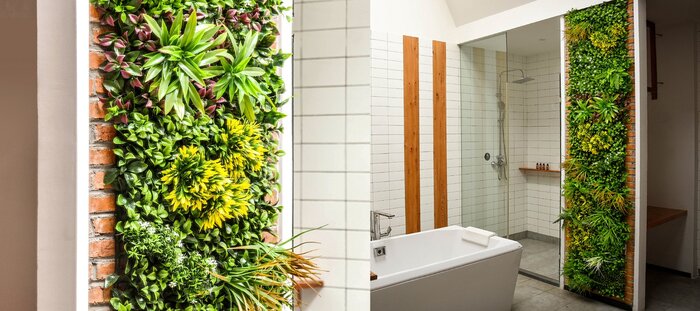 green bathroom with white tiles on the wall and a bathtub 