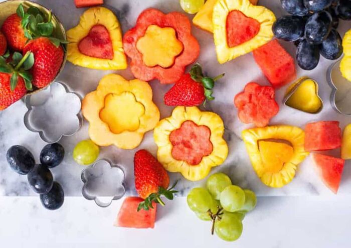 fruit cut outs flowers and hearts cut out of different fruits strawberries grapes watermelon 