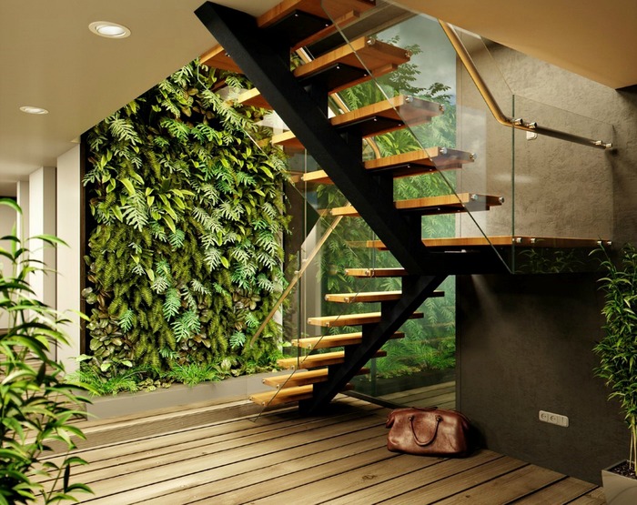 interior design trend modern interior with a green wall made of living plants and a wooden staircase