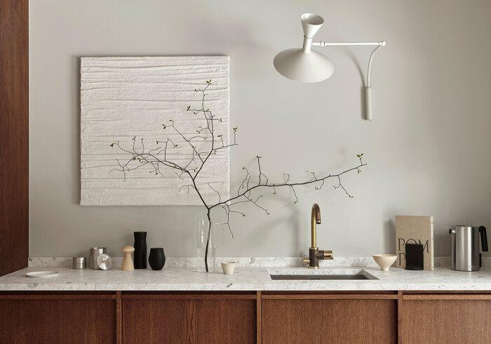 Bespoke design kitchen in stained oak with white accent lighting and simple decorations