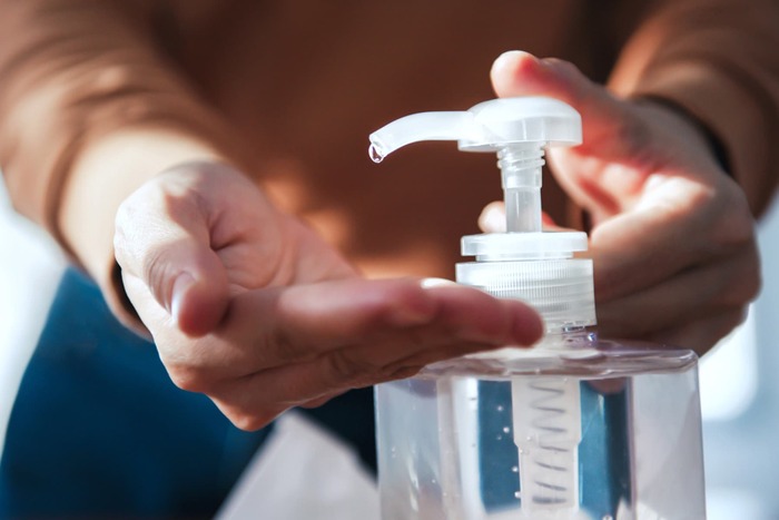 sanitizer person using a sanitizer on their hands outdoor