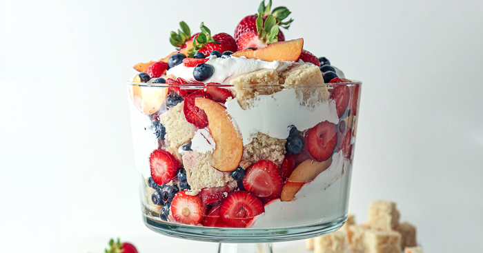 trifle fruit a large glass bowl with fruits cream and biscuits