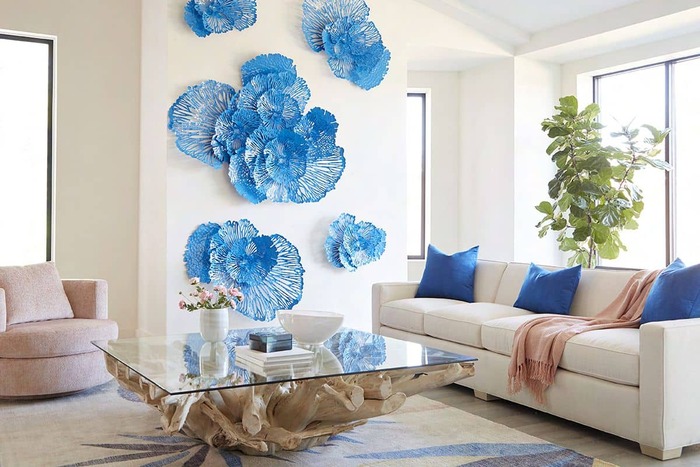 blue wall art white and blue living room with a wooden and glass table