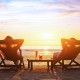 happy couple enjoy luxury sunset on the beach during summer vacations