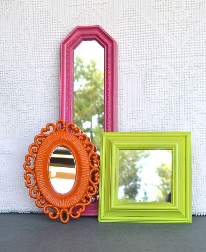 three colorful mirrors in different sizes on a white wall summer decor pieces