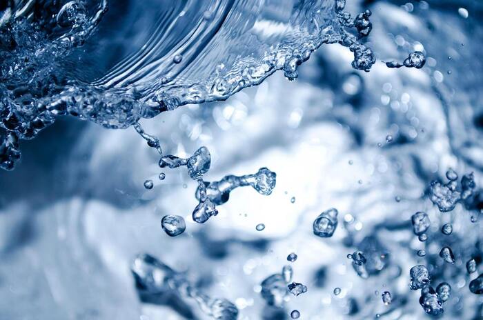 mineral compounds in the water close up splash of blue water drops