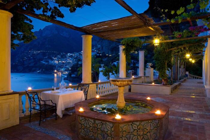 Villa Treville Positano Italy at night with lanterns on open terrace overlooking the amalfi coast