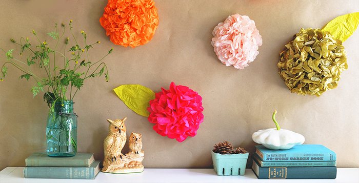 summer flowers colorful wall decor in a home interior books and a blue vase