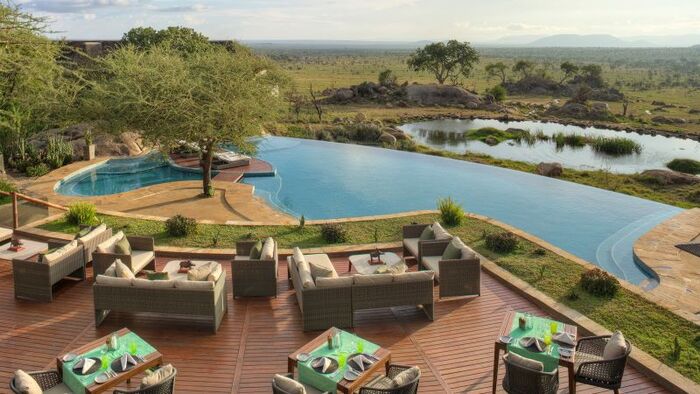 Four seasons hotel in tanzania pool with lounge areas with luxury furniture and breathtaking views