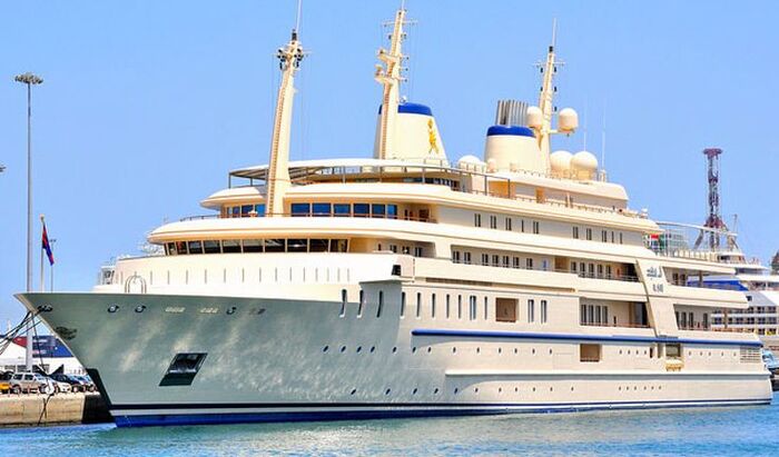 al said luxury yacht outside in a port large white and blue yacht