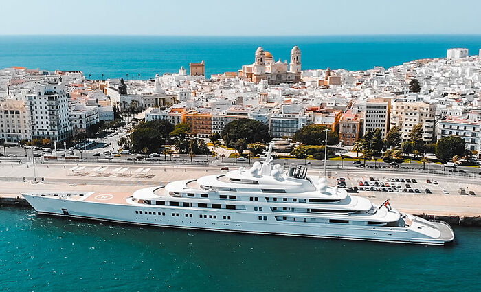 azzam yacht large luxury yacht with beautiful port town in the background