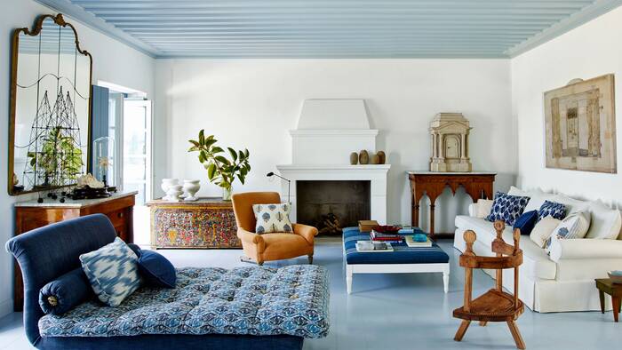 blue accents in the interior blue ceiling in a traditional living room with blue furniture pieces