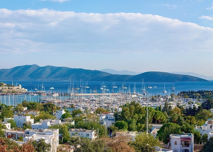 bodrum city with boats in the background and a mountain range