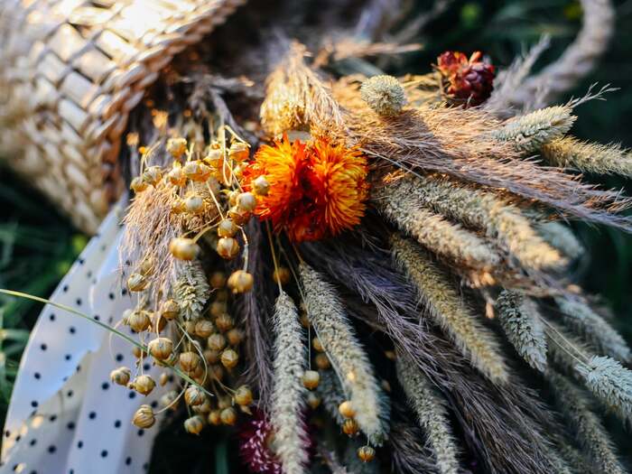 bouquet of dried flowers lying on the ground in a basket different types of dried flowers arranged together