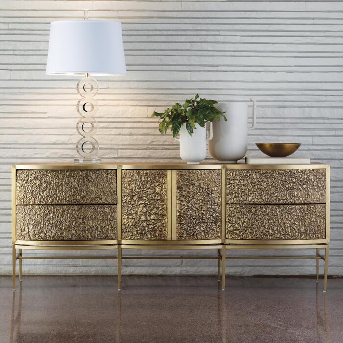 brass and bronze metal piece of furniture with a golden color and a white lamp