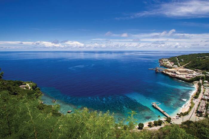 christmas island in Australia beach with beautiful blue water peers and blue sky with horizon