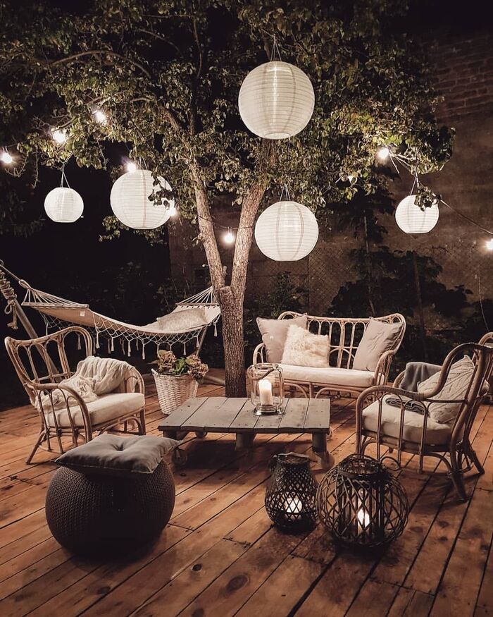 cozy outdoor area with large oval lanterns hammock and garden furniture