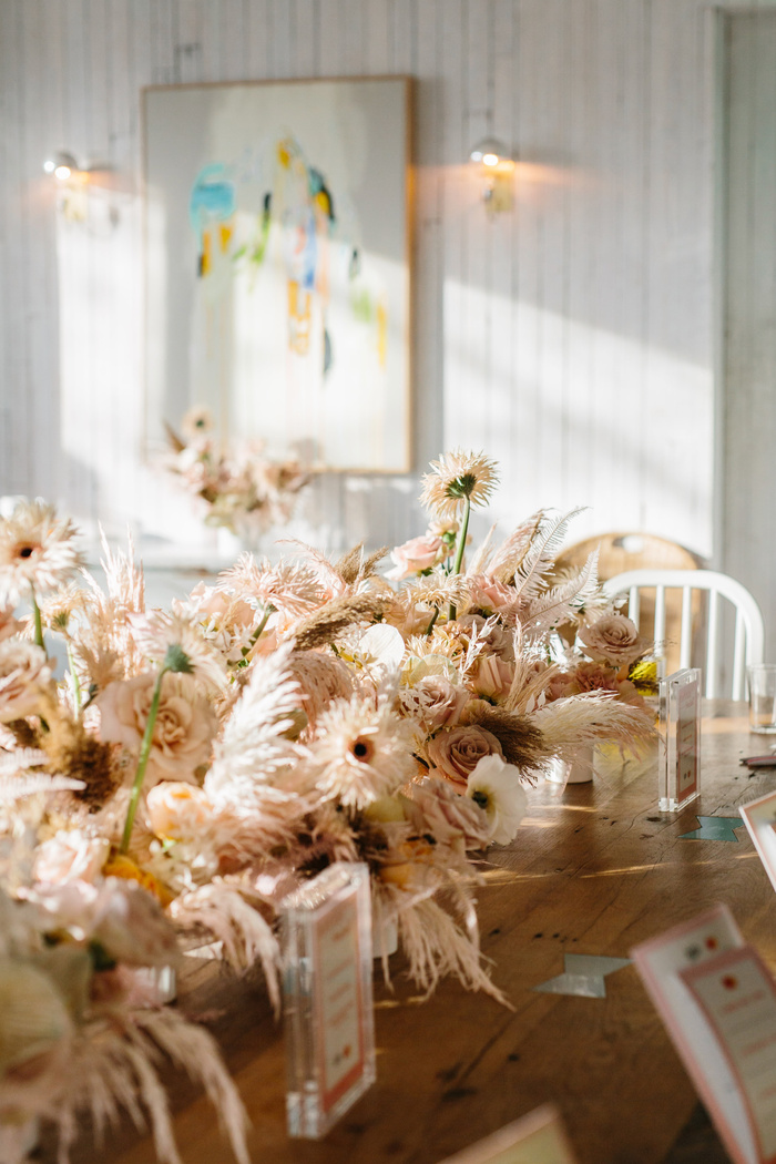 interior decor dry flowers on a living room table with white interior in the background