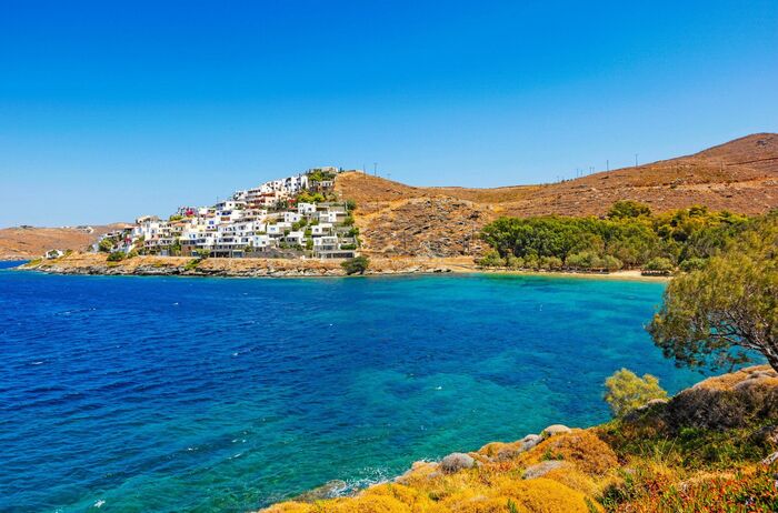 Kea island in Greece beautiful blue sea with cliffs and houses on them surrounded by trees