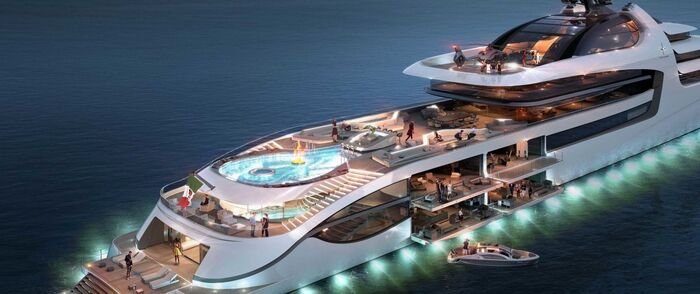 luxury yacht with lights on in the middle of the sea with a large pool 