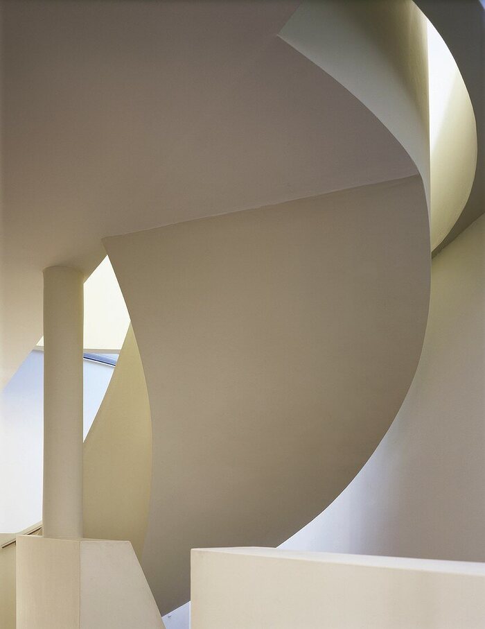 Architectural styles sharp white curves in the interior of a building 