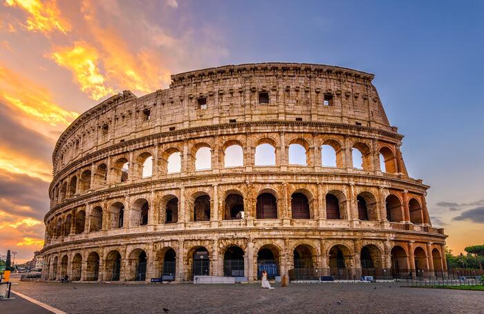 The Coliseum in Rome evening picture with sunset in the sky 