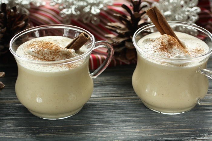eggnog drink alcoholic fall themed drinks in glass cups and cinnamon sticks inside
