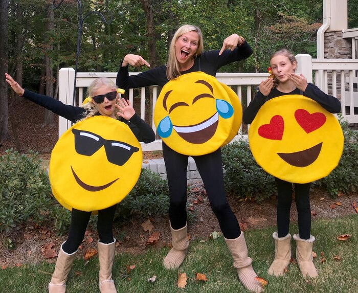 mom and her two girls dressed in no sew halloween costume emojis posing outdoors