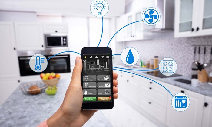 phone smart thermostat technology woman holding a mobile phone and choosing the options for her smart kitchen