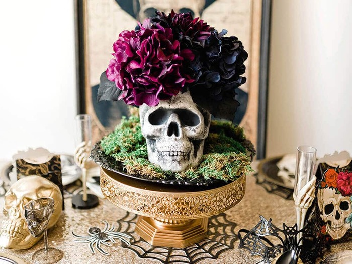 skull flowers skull flower table centerpiece on a golden stand in the middle of a table