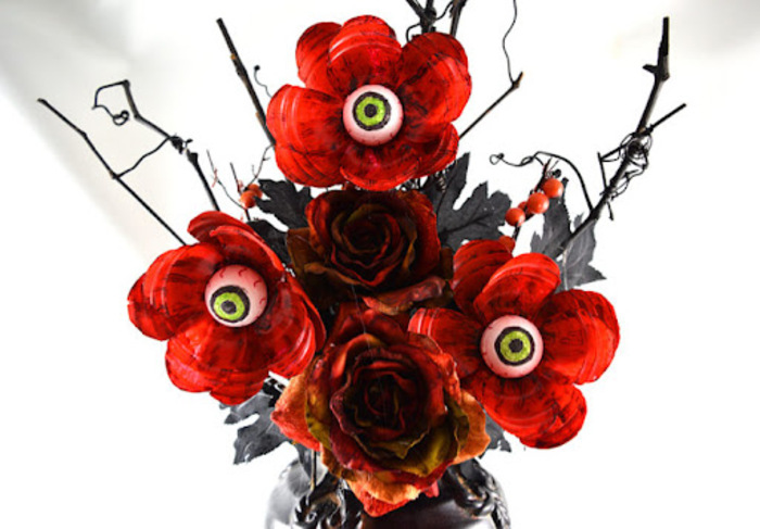 spooky flowers halloween flower arrangements with candy red roses with eyeball candy in the middle