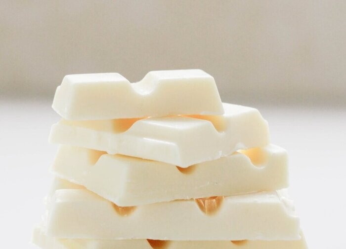 stacked pieces of white chocolate on a white background