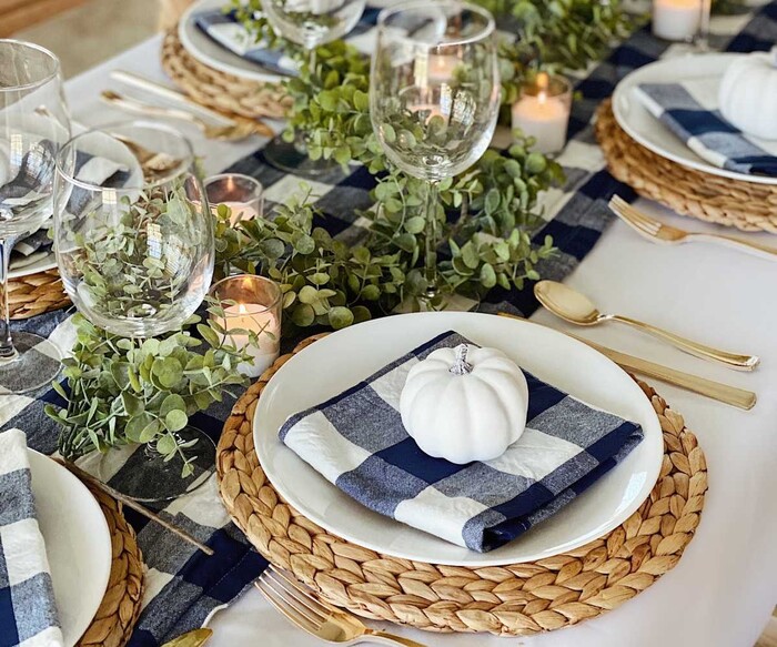 blue and white table fall thanksgiving table diesign tea candles and rattan place mats