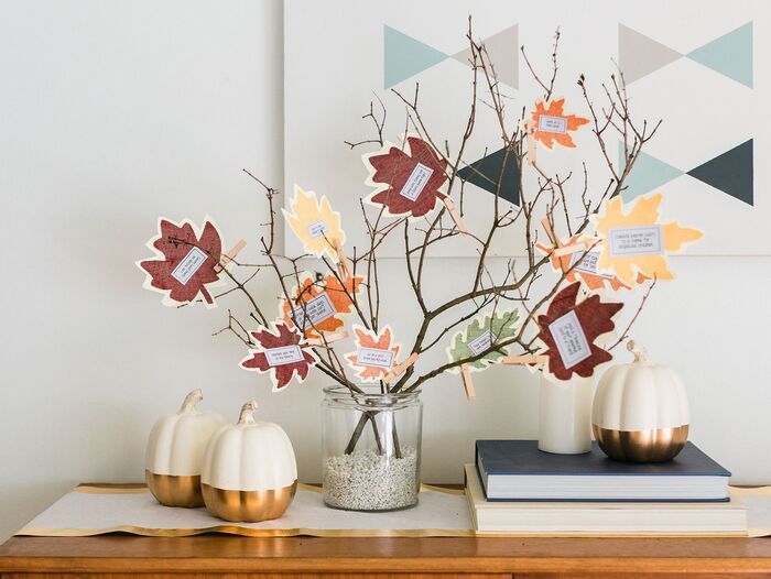 thankful tree with paper cut leaves in a living room fall setting