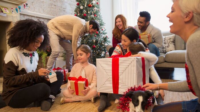 giving gifts for Christmas family enjoying time together in a holiday environment