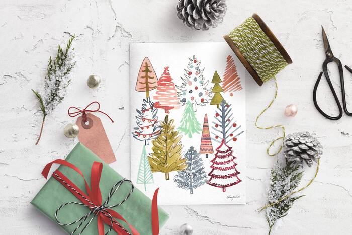 home decor christmas decorations a green gift pine cones and drawings of decorated trees