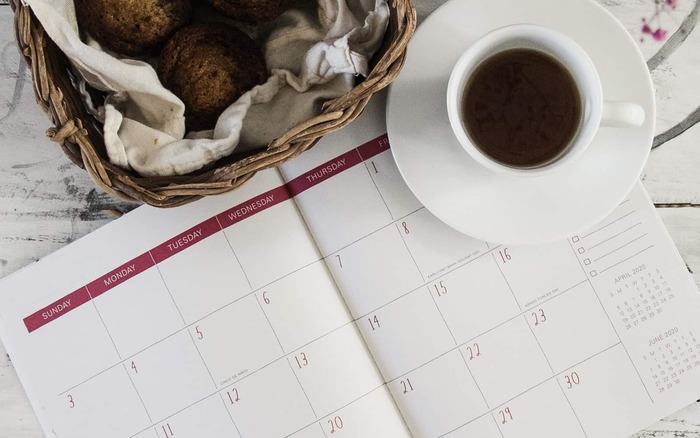 build new habits calendar close up on a table with a coffee cup and a basket