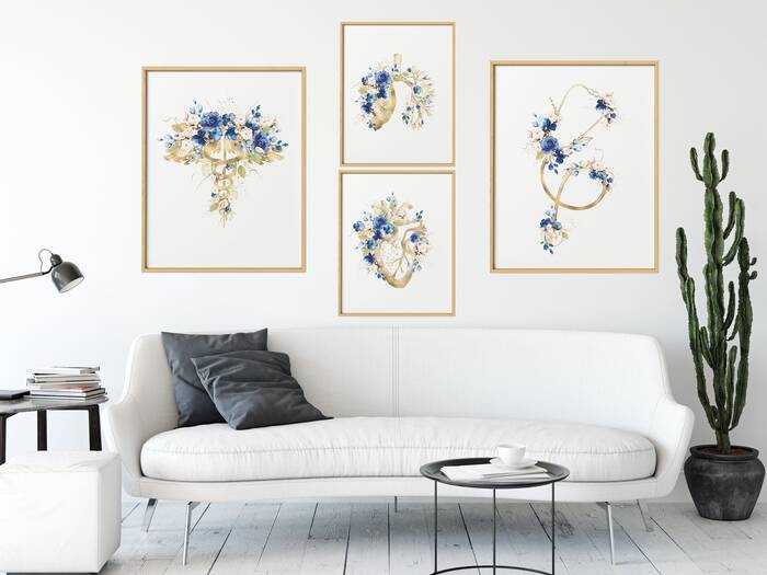 feminine home office with modern white interior with floral prints on the wall and a modern white couch