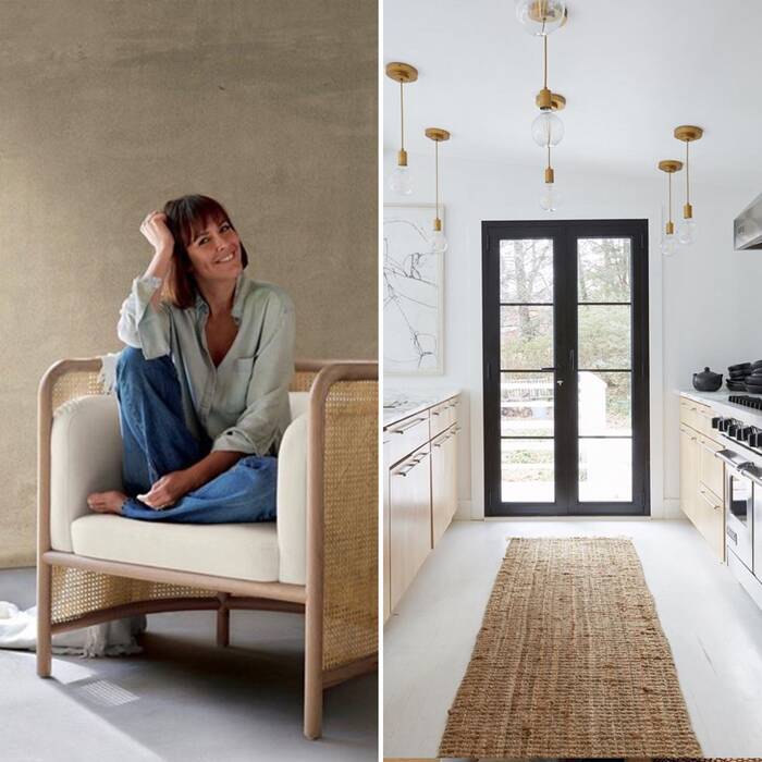 female interior design sitting on a large chair with a beige wall in the background next to her a picture of kitchen design