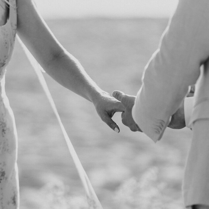 couple in love holding hands in a black and white photo