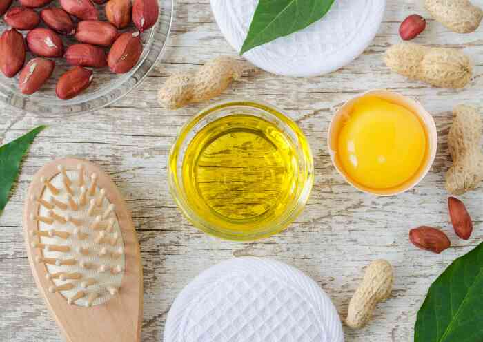 DIY haircare different ingredients for haircare at home egg yolk oil nuts and hair brush