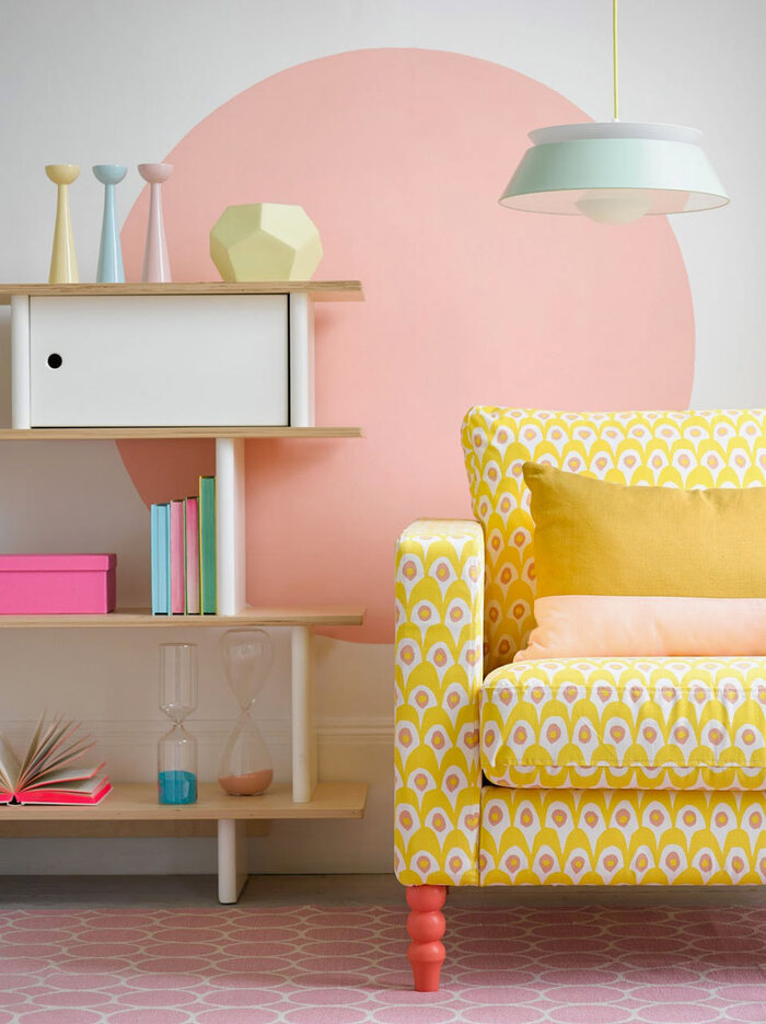 modern design pastel living room design with an accent yellow chair and pink and blue decor elements