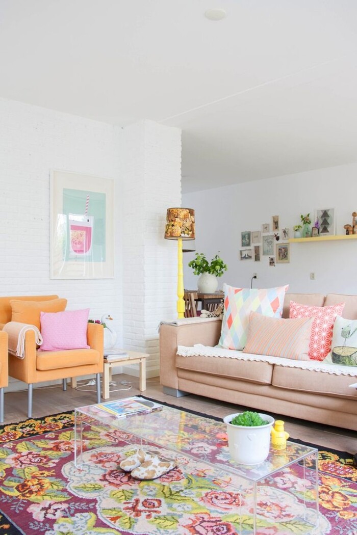 pastel living room pastel interior design colorful rug and light colored chair and sofa in a living room with white walls