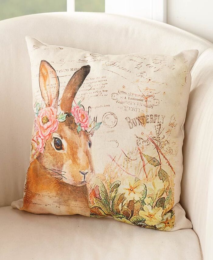 vintage pillow with a bunny on a white couch
