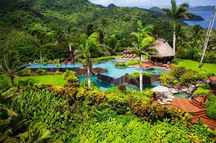 Laucala Fiji sea villa island resort surrounded by tropical plants and stunning viewes