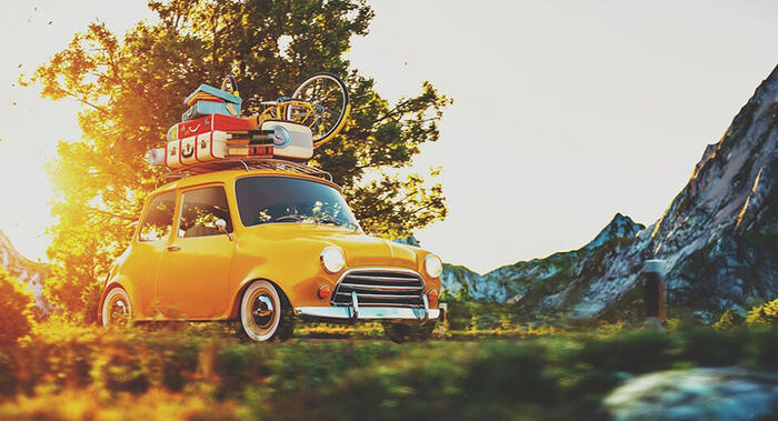 close travel little yellow car with some luggage on it travelling through a natural landscape