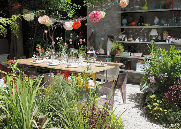 garden for small areas arranged outdoor table surrounded by grass and plants and party decorations