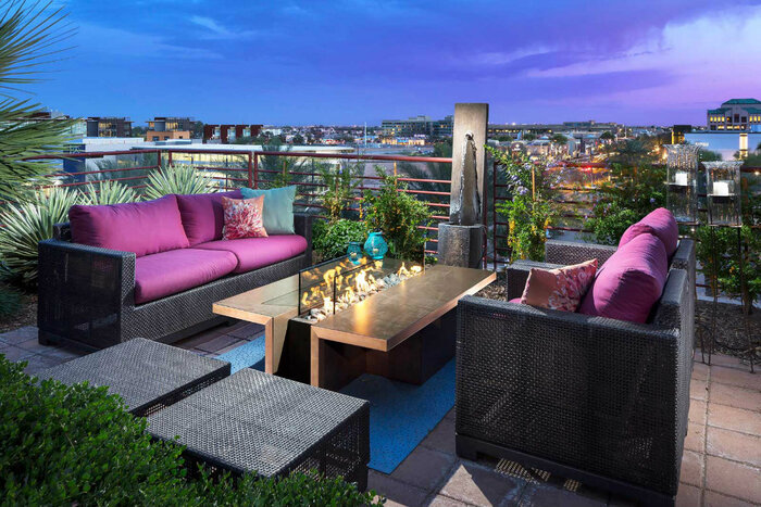 luxury balcony design with black and purple furniture and plants